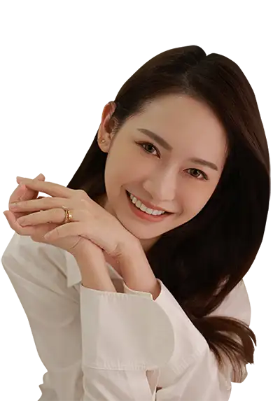 A girl smiling with her teeth showing, wearing clear aligners.